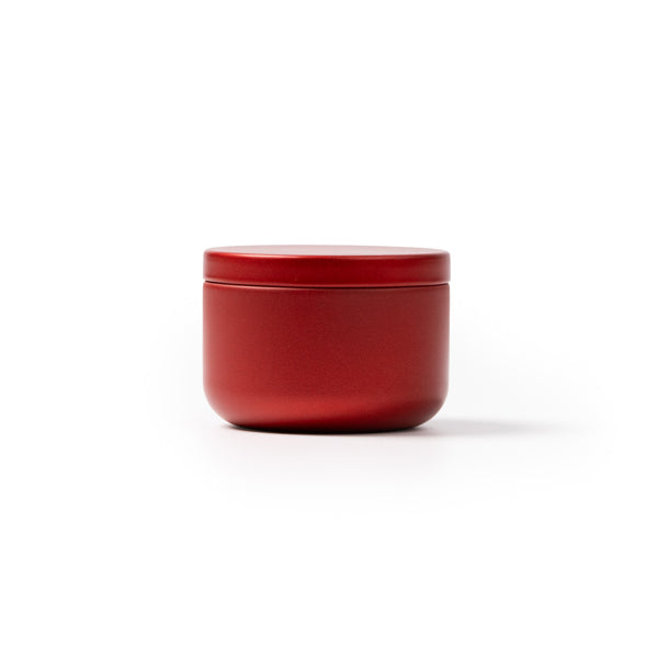 Stamina Gento a round metal candle in red, ready for laser engraving