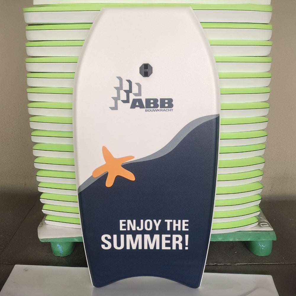 Stack of custom printed bodyboards with a full-colour summer graphic