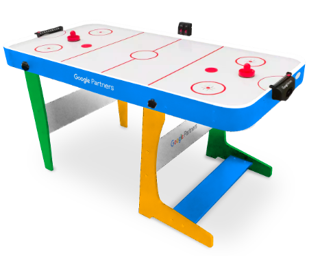 Folding air hockey table with a multicoloured full-colour printed wrap on the sides and legs