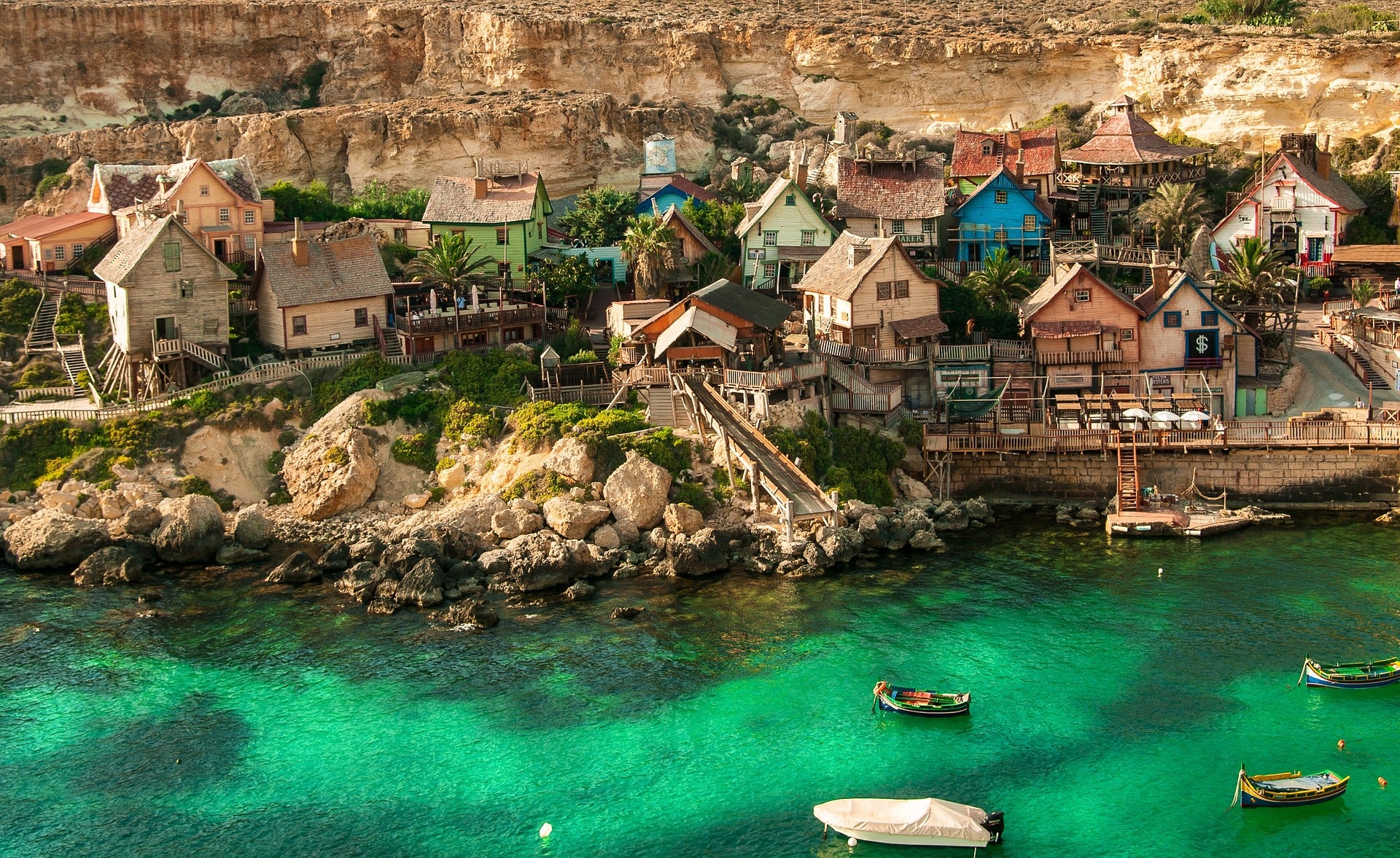 Promotional products and merchandising in Malta — featuring a view of Valletta Bay and Popeye Village | Gadget aziendali e merchandising a Malta — vista sulla baia di Valletta e Popeye Village | Prodotti promozzjonali u merċandajsing f’Malta — veduta tal-Bajja ta’ Valletta u Popeye Village